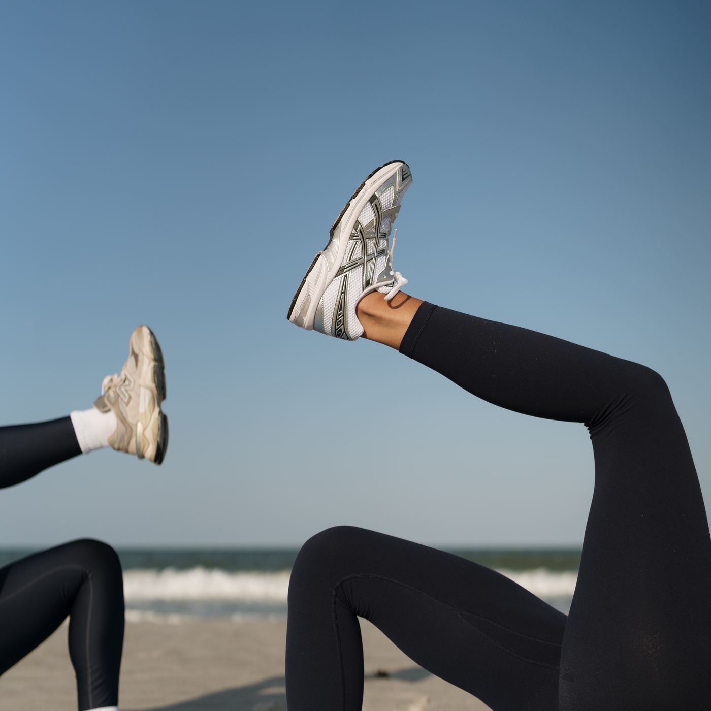 Legs kicked mid-move on the sand — Drench'd detail